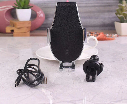 Phone holder with charging cable on a table